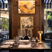 An inside table seat at Quercus: Look outside and you can see the courtyard with its iconic oak tree.