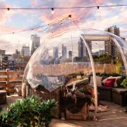 Find one of London's most scenic dining igloos at Skylight Tobacco Dock